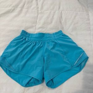 Lululemon hotty hot shorts… low rise… 4 inch length… size 4… electric turquoise.